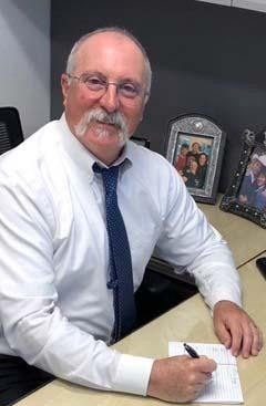 A man writing something on notebook